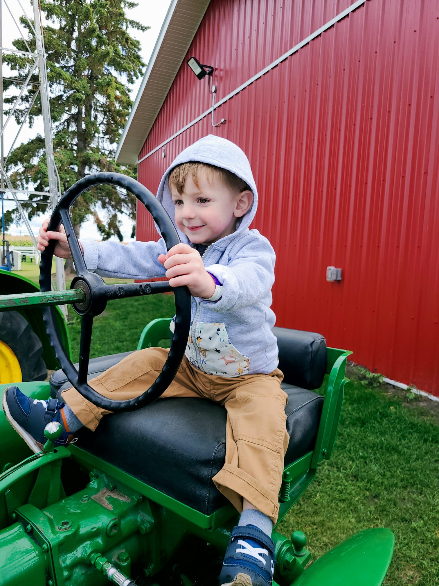 Everett-Dr. Joseph Tanti's eldest son- sitting on a tractor